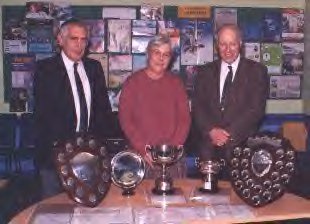 Geoffrey Williams, June Williams and Society president John Reid display trophy's won at the East Midland and East Anglian Philatelic Convention, 2000